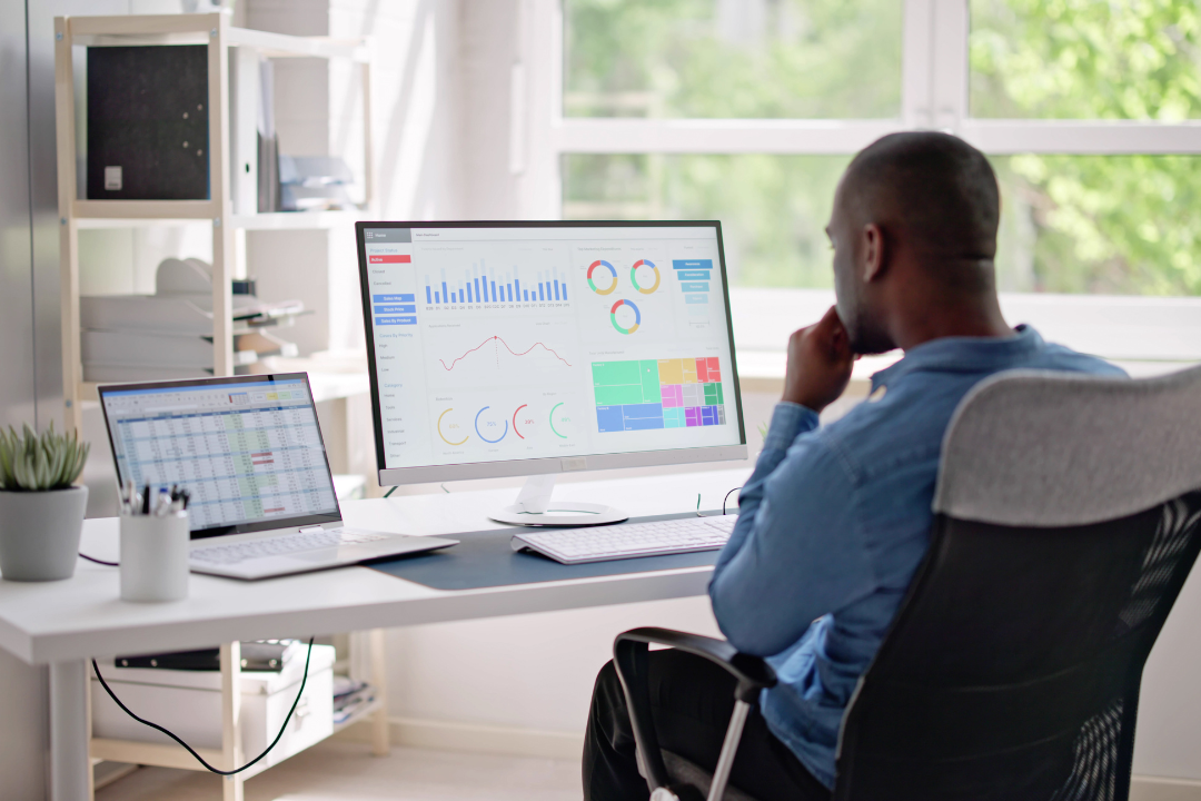 Digital marketers analyzing backlink data and website authority on modern computer dashboards.